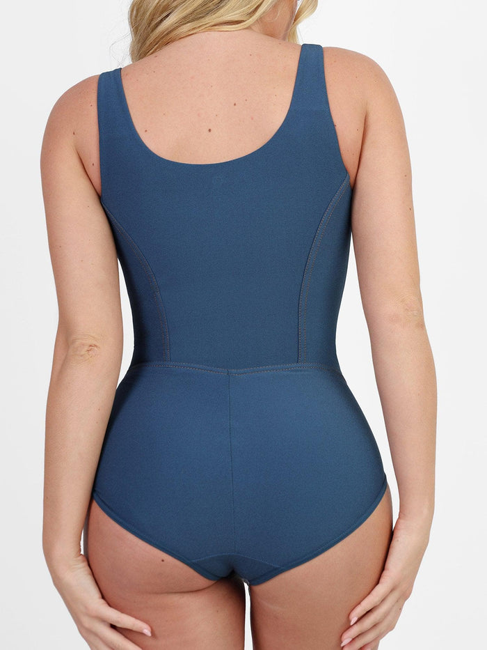 Blue denim tummy control corset shapewear bodysuit, back view.