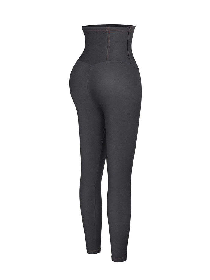 High-waist dark denim shapewear leggings with tummy control and shaping waistband.