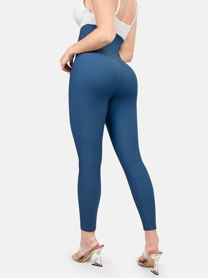 Blue high-waist tummy control denim leggings with shaping waistband for slimming.