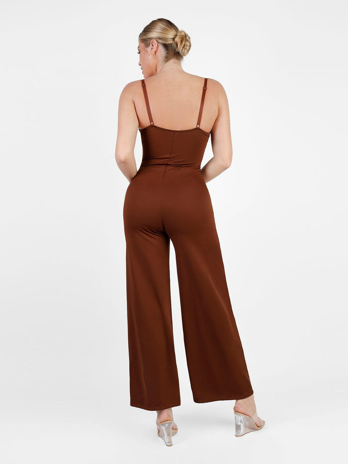 Back view of brown sculpting wide-leg shapewear jumpsuit with adjustable straps.