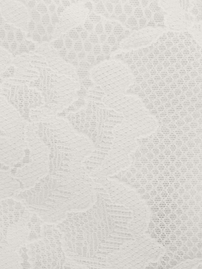 White lace fabric, a detail of Popilush® bodysuit, showcasing the intricate pattern.