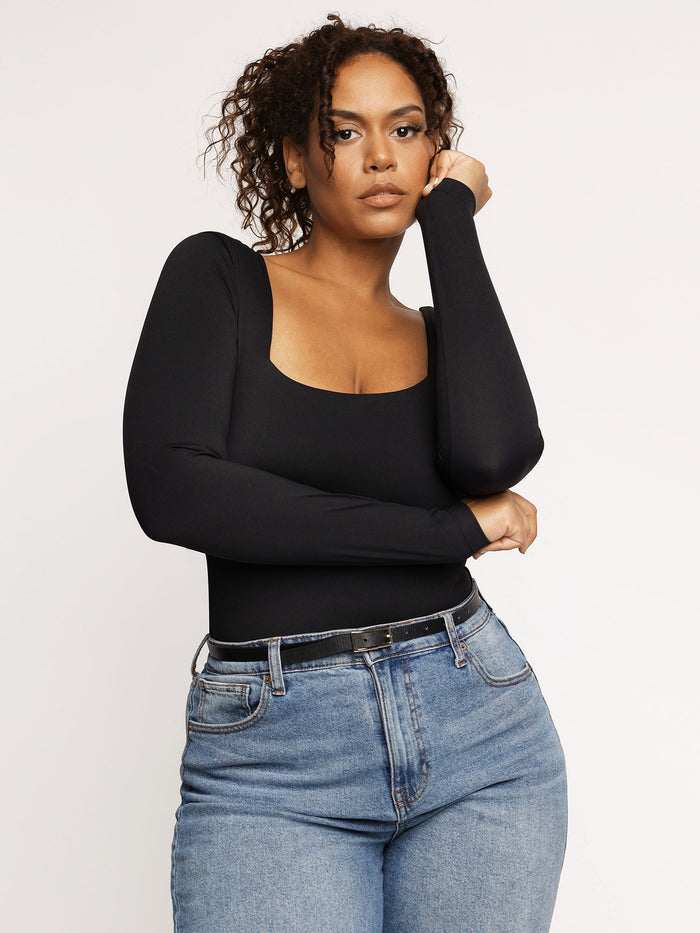 Black long-sleeve square neck tummy control bodysuit with blue jeans