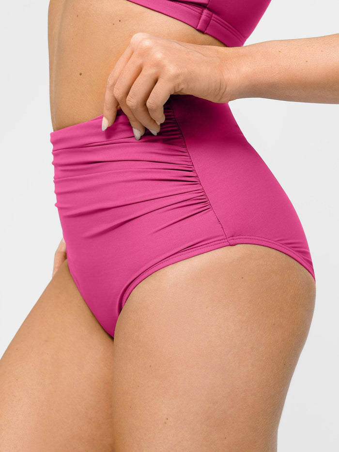 Pink ruched high-waist bikini bottom, shapewear style with tummy control feature.