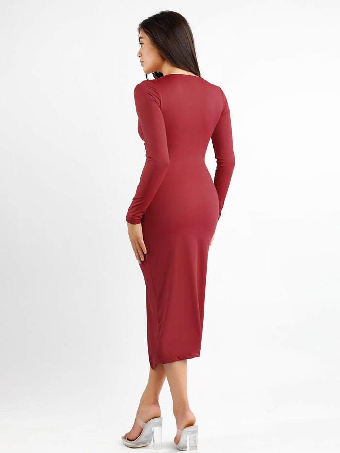 Red long sleeve bodycon midi dress with ruching and split hem, featuring built-in shapewear.