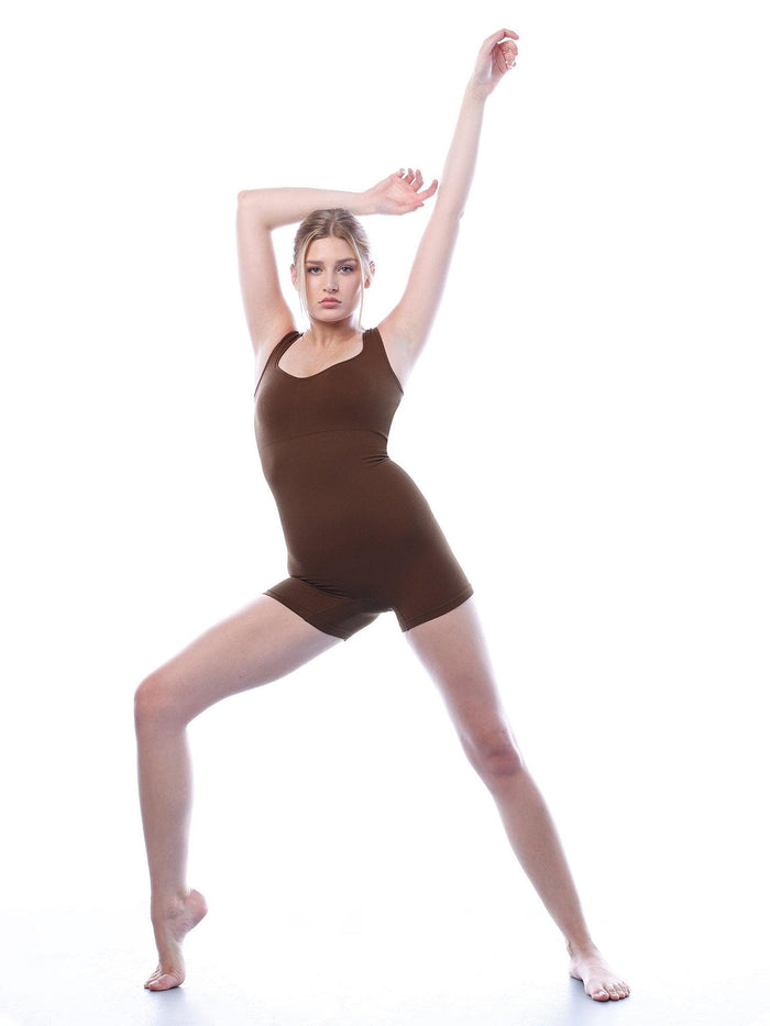 Shapewear model showcasing Popilush® romper with active pose and stylish design.