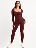 Seamless burgundy long sleeve shapewear jumpsuit with square neck and thumb holes.