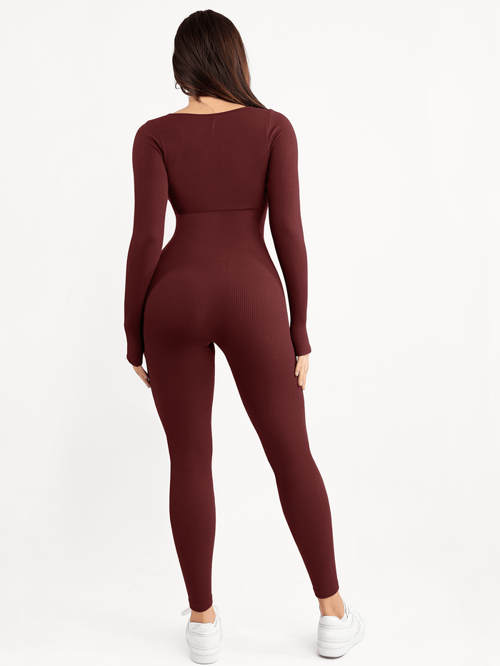 Burgundy seamless long sleeve shapewear jumpsuit with thumb holes and ribbed texture.
