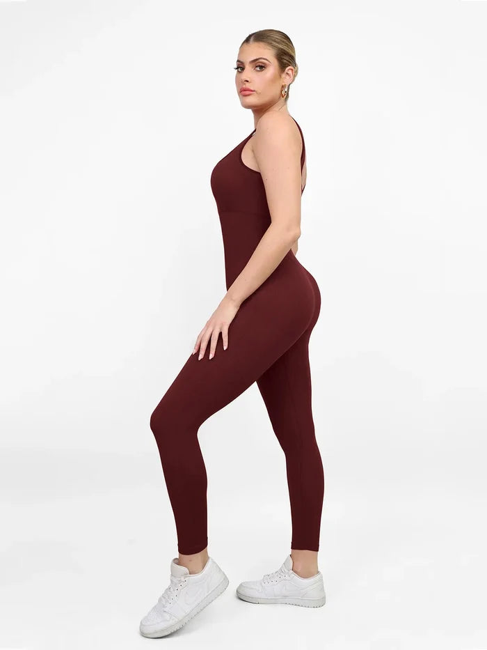 Maroon seamless shapewear workout jumpsuit with square neck and butt lift feature, side view.