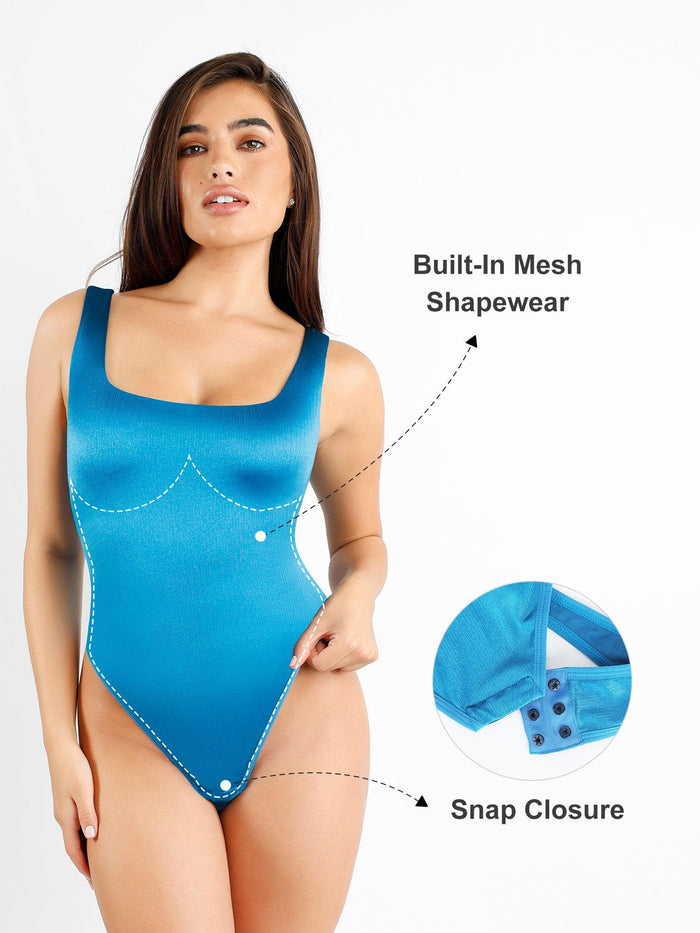 Shiny blue square neck thong bodysuit with built-in shapewear and snap closure.