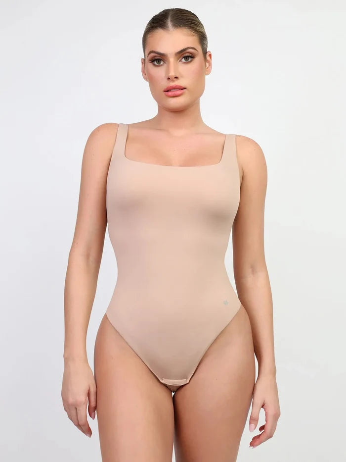 Seamless nude CloudSense shapewear tank top bodysuit with high-cut thong.
