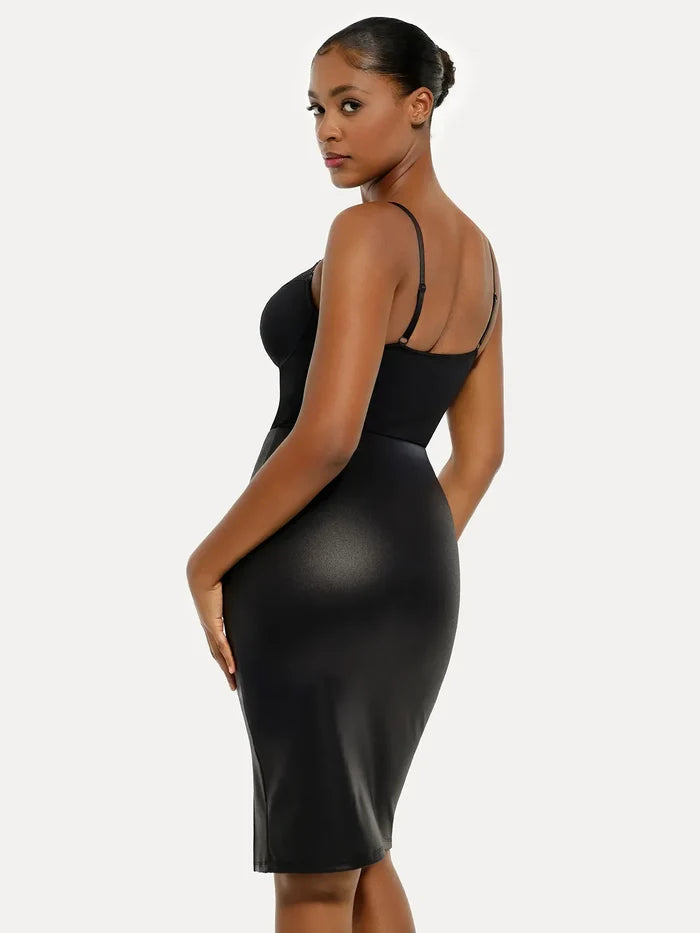 Black strappy shapewear bodysuit with lace inset bust, tummy control, and sleek sculpted fit.