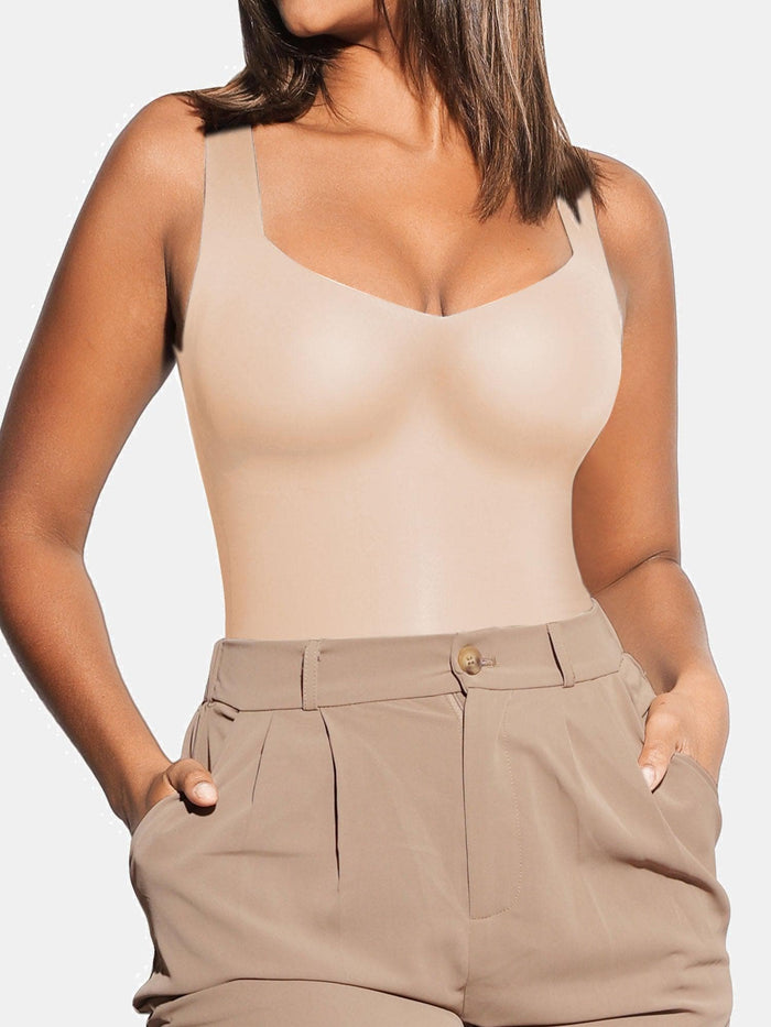 Seamless beige tank bodysuit with sweetheart neckline, smoothing the body's silhouette.