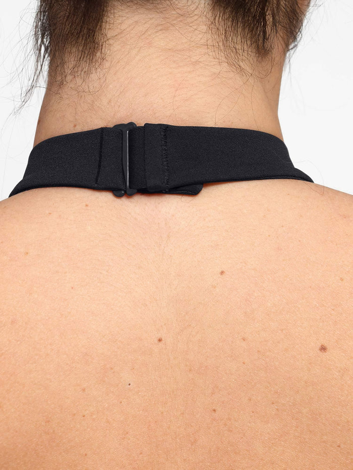 Adjustable black halter neck strap detail on Popilush shapewear jumpsuit.
