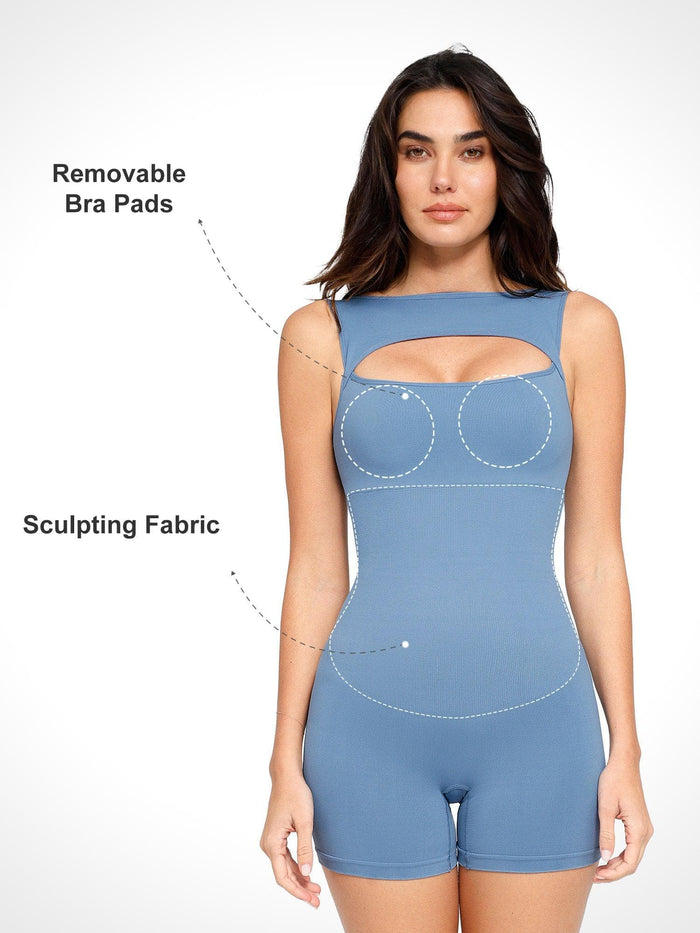 Blue seamless tummy control shapewear romper with cut-out chest and sculpting fabric.
