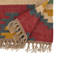 Saro Lifestyle Tribal Tapestry kilim table runner in red teal and gold, folded corner detail