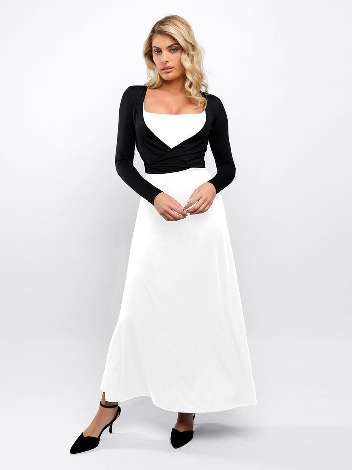 Woman in Popilush® black wrap cardigan and white dress, versatile style.